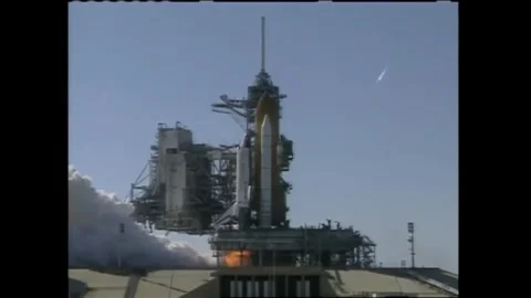 Rocket booster firing for Space shuttle Discovery launch with John Glenn onboard Stock Footage 262065018