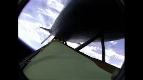 Rocket cam of NASA's Space Shuttle Atlantis releasing solid rocket booster Stock Footage 283460413