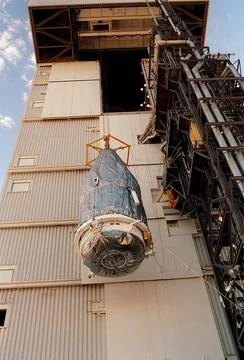 The rocket faring is lifted up the launch tower for mating with the Lockhe... Stock Photos