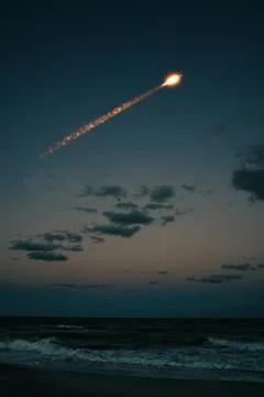 A rocket flying over the ocean Stock Photos