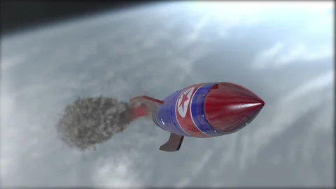 A rocket is flying in the sky. Flag of North Korea. Weapons of mass destruction. Video stock 146858171