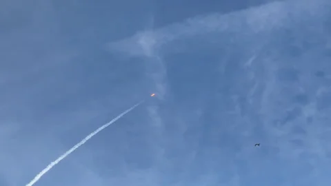 Rocket launch from Florida on a clear blue sky day Stock Footage 327770779