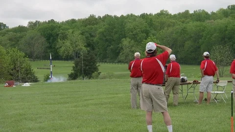 Rocket launching from green landscape Video stock 100171925