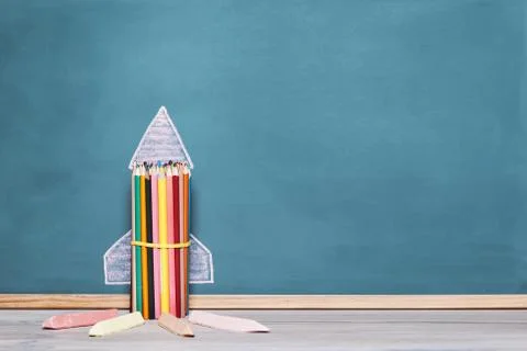 Rocket made with crayons on a blackboard Stock Photos