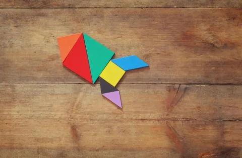 Rocket made from tangram puzzle Stock Photos