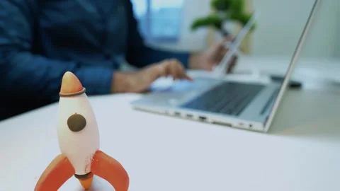 Rocket Model on Desk with Laptop in Background Stock Footage 318578368