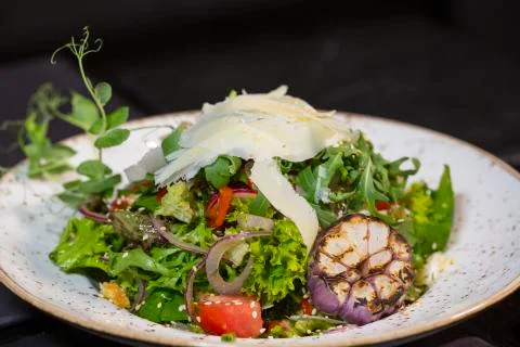 Rocket salad with parmesan cheese Stock Photos