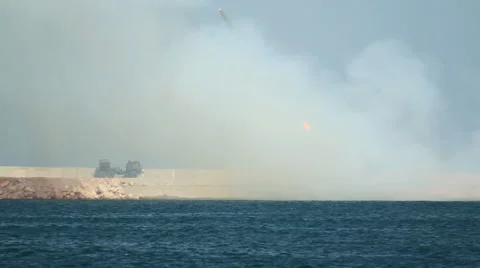 Rocket salvo - rocket artillery attack on the coast Stock Footage 40486976