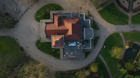 ROCKET SHOT OF A CHURCH IN THE MIDDLE OF A CEMETRY WITH BEAUTIFUL LANDSCAPE Video stock 150286505