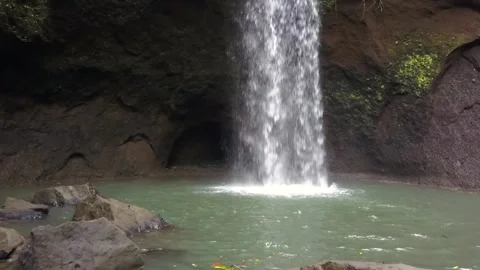 Rockfall. Perfect aerial view flight drone bali jungle waterfall indonesia Stock Footage 228951254