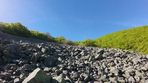 Rockfall from the top of the mountain summit in view of a drone. Stock Footage 310331062