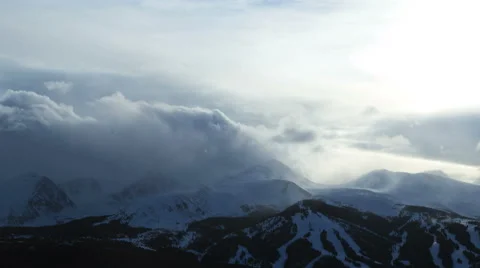 Rockies Colorado clouds winter snow mountain resort tourist hiking time lapse Stock Footage