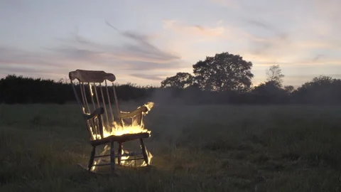 Rocking chair on fire Stock Footage 281424027