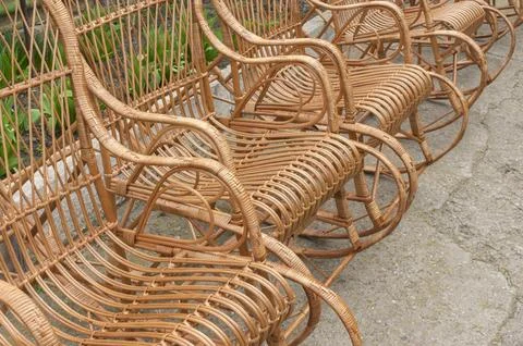 Rocking chairs standing made with withe staning on rough surface Stock Photos