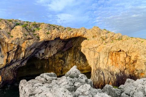 Rocks and cliffs grotto cave for water extreme terrain natural wilderness pla Stock Photos