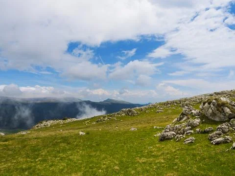 Rocks and clouds in mountain landscape. Romanian Carpathians. Scenic landscap Stock Photos