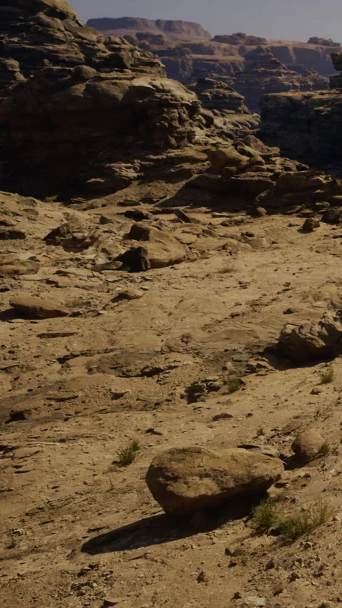 Rocks and dry terrain found in a canyon during midday in desert landscape Stock Footage 331440508