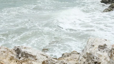 Rocks and the Indian Ocean waves near Pandawa Beach, Bali - 4K Stock Footage 180975455