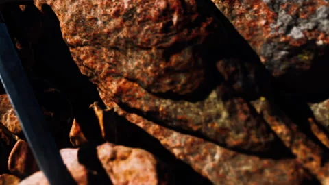 Rocks and a knife on the ground during an outdoor activity in bright light Stock Footage 340227720