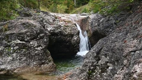 Rocks and a mountain stream in a forest in autumn Stock-Footage 260863801