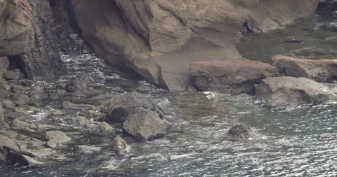 Rocks and the ocean, 4K slomo Stock Footage 245751231