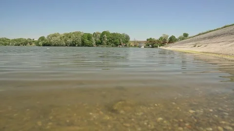 Rocks and pebbles cover the bottom of lake Moharac in Serbia Stock-Footage 269540932