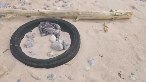 The rocks and the sand on the with the tire Stock Footage 152657792