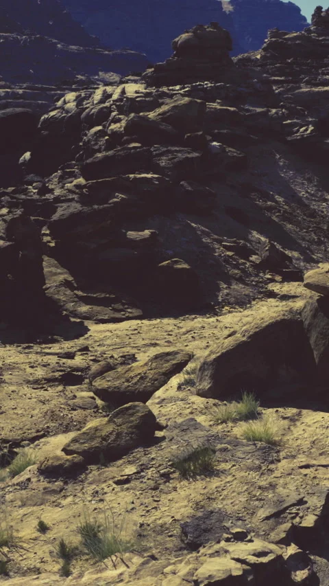 Rocks and sandy ground at a rugged landscape in a dry area Stock Footage 331752792