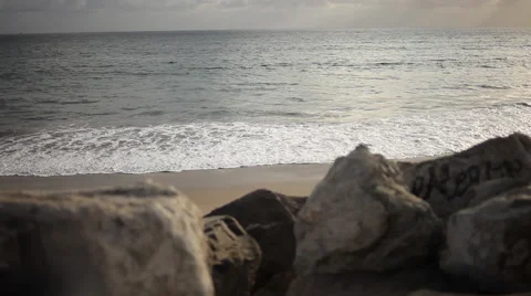Rocks and small surf on the coastline Stock Footage 58631775