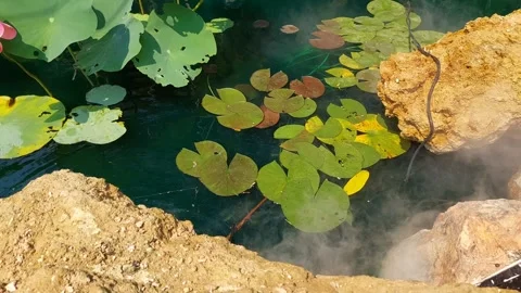 The rocks and smoke simulate a waterfall. Stockbeeldmateriaal 276353908