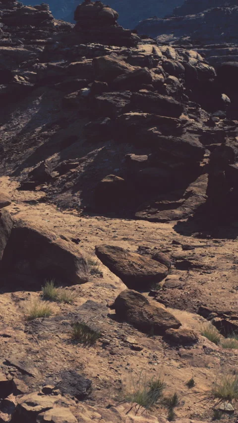 Rocks and soil in a dry landscape under a clear sky Stock Footage 340888497