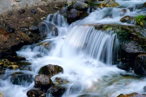 Rocks and waterfall Stock Photos