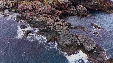 Rocks and waves along the coastline near the ocean shore Stock Footage 335143121