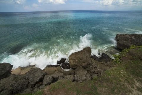 Rocks and waves on the beach Stock Photos