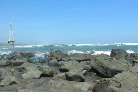 Rocks and waves of the beach Stock Photos