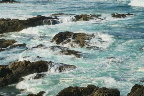 Rocks and waves Stock Photos