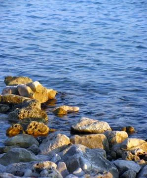 Rocks and waves Stock Photos