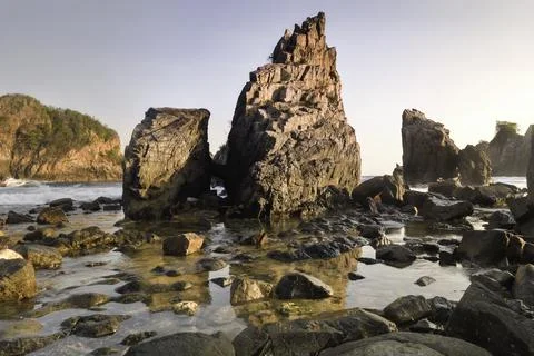 Rocks and waves in the sea. Stock Photos