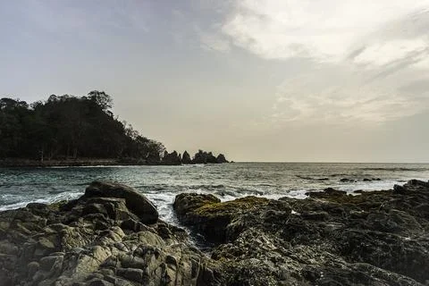 Rocks and waves in the sea. Stock Photos