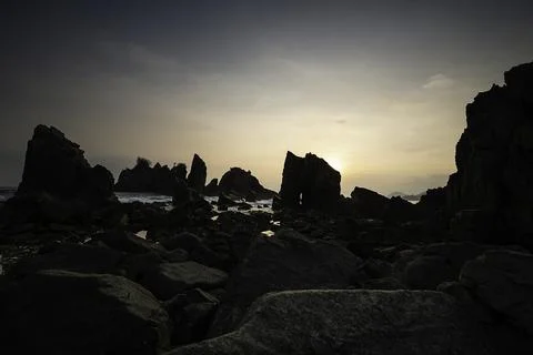 Rocks and waves in the sea. Stock Photos
