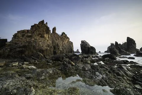 Rocks and waves in the sea. Stock Photos