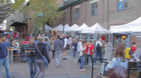 The rocks area at circular key - pan of people shopping on a sunny day Stock Footage 36686114