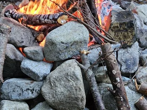 Rocks around fire pit cracking due to temperature flux in a campground Stock Photos