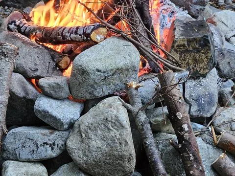 Rocks around fire pit cracking due to temperature flux in a campground Stock Photos