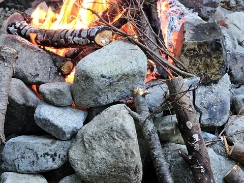 Rocks around fire pit cracking due to temperature flux in a campground Stock Photos