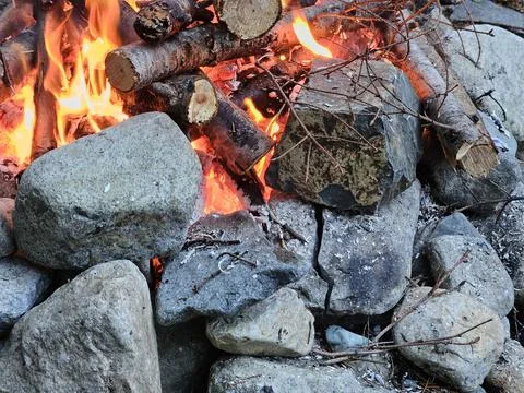 Rocks around fire pit cracking due to temperature flux in a campground Stock Photos
