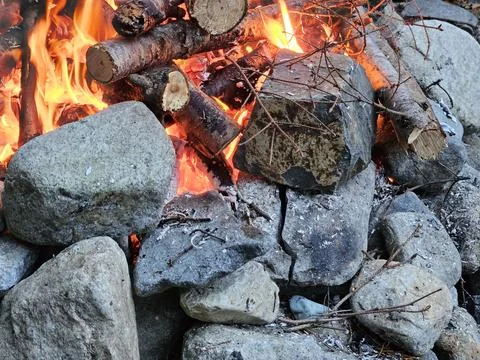 Rocks around fire pit cracking due to temperature flux in a campground Stock Photos