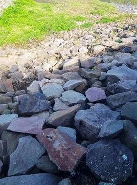 Rocks arranged on the side of a road Foto stock