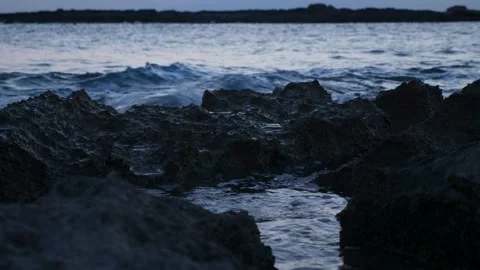 Rocks bathed by the ocean Stock Footage 131350379