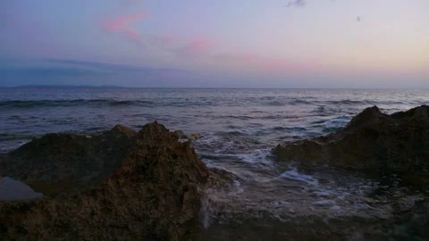 Rocks bathed by the ocean, sundown Stock Footage 131350155